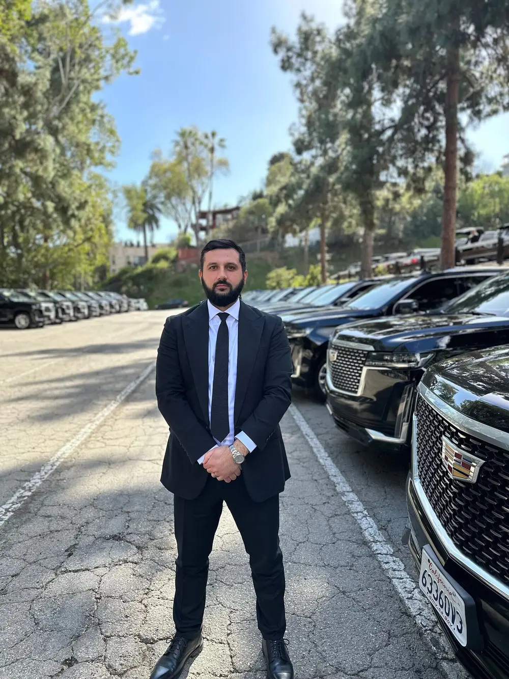 Limo Laguna chauffeur with the Escalade fleet